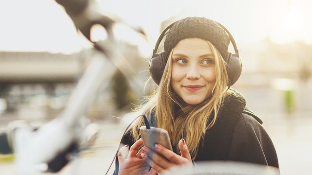 woman-listening-to-music-stock-photo-1460130037-list-handheld-0.jpg