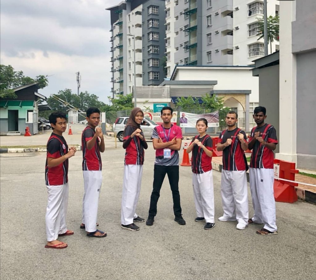 Photo of Taekwondo players and coach